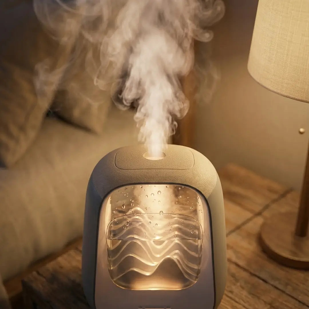 Humidifier emitting steam on a wooden table with warm ambient lighting
